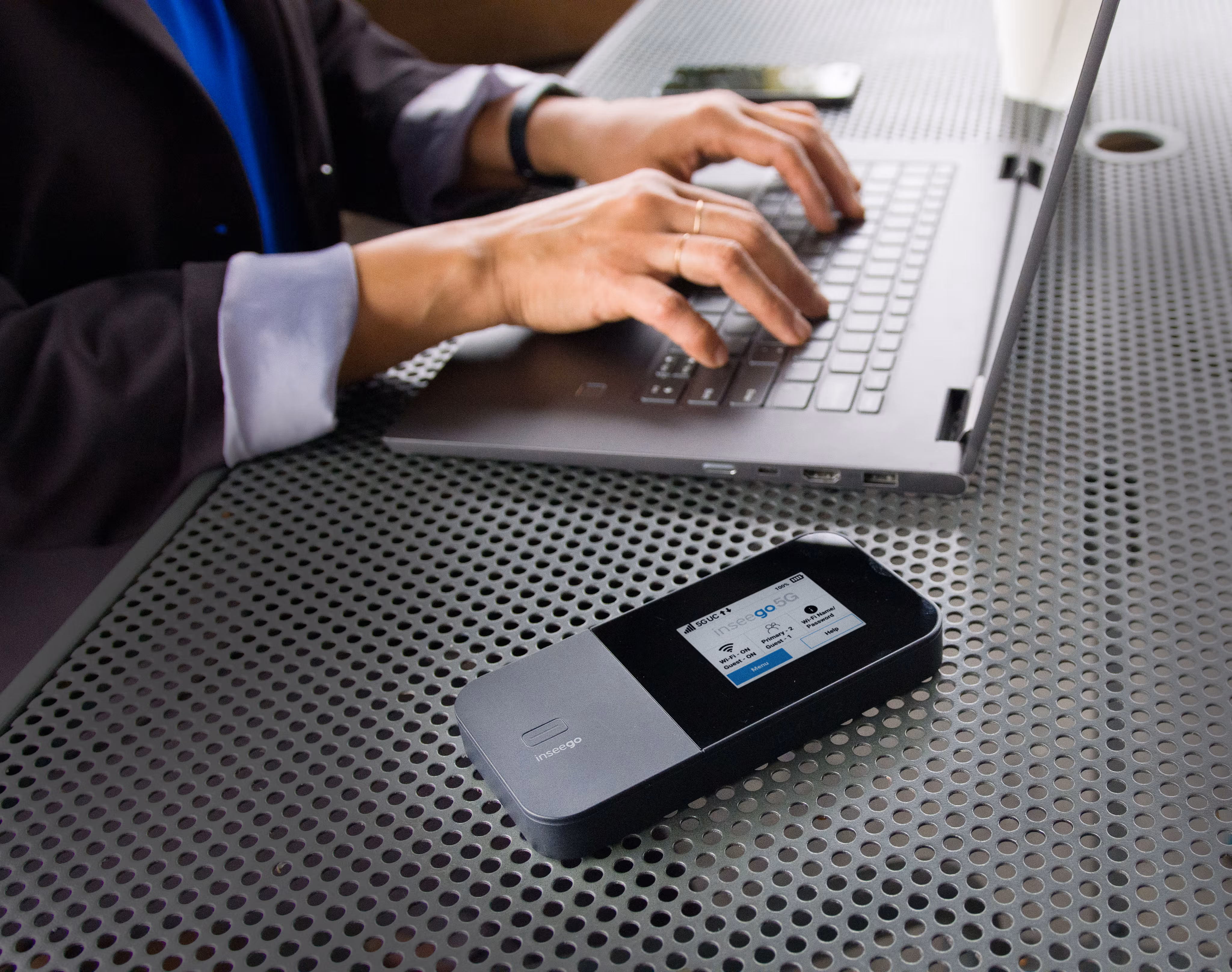 The MiFi X PRO business-grade hotspot being used by an employee working on their computer